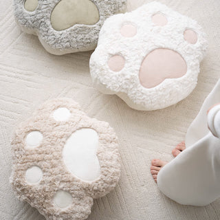 Comforting Dog Paw Print Pillow in Neutral Tones Soft and Playful Design